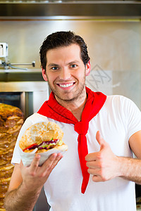 Kebab  热辣的多纳尔 配有新鲜原料食物饭馆饥饿烤肉小吃店沙拉店铺男性面包男人图片