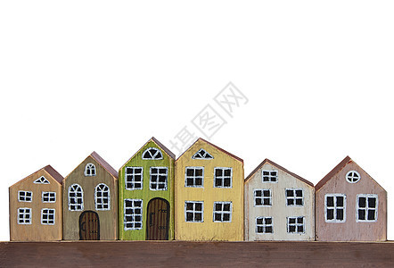 白色背景的木玩具屋 由木制的微型小镇图片
