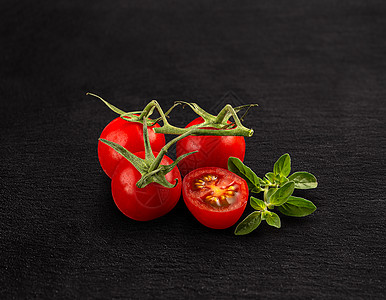 红樱桃番茄蔬菜叶子红色团体食物黑色背景图片