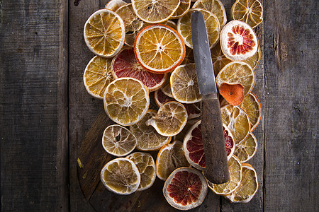 干柑橘片框架木头家具冷拔水平芳香柚子干果圆形柠檬背景图片