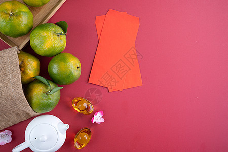 中国新年月球红背景的新鲜橙色最佳景象篮子食物财富运气平铺热带橙子高架水果桌子图片