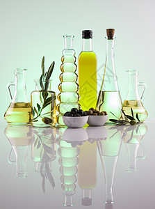 瓶装橄榄油 橄榄枝和煮油水果橄榄林农业饮食收成烹饪植物液体处女绿色图片