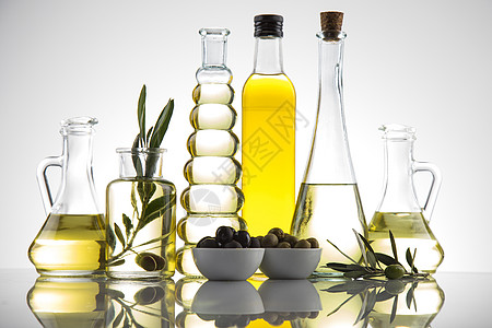 瓶装橄榄油 橄榄枝和煮油收成农业食物树叶黄色处女绿色植物烹饪饮食图片