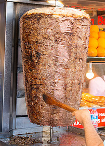 土耳其传统烹饪街食物的土裔油炸午餐炙烤火鸡厨师小吃陀螺仪餐厅车削旋转图片