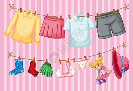 挂衣服挂在粉红色背景上的衣服设计图片