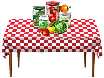 桌上罐装蔬菜和方格图案桌布的蔬菜图片