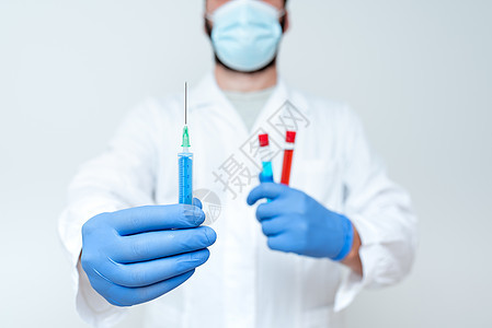 化学家解释疫苗接种计划 病毒预防程序 实验室实验 研究科学家展示医学治疗 战胜感染生物学医生蓝色面具科学防护全科疾病人手注射器图片