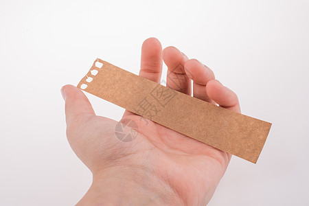 胶带纸手握着一块纸笔记邮政商业广告牌写作办公室空白背景