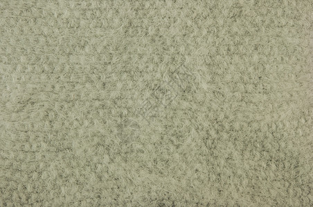 它是针织质地或背景毛衣墙纸纤维毯子编织工艺宏观风格地毯材料图片
