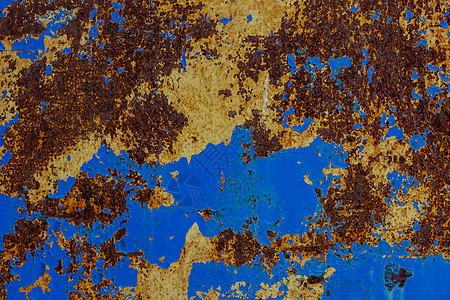 生锈钢板的平面质地 有两层剥落的油漆 — 黄色和蓝色图片