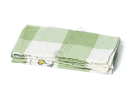 白色背景的折叠绿毛巾图片