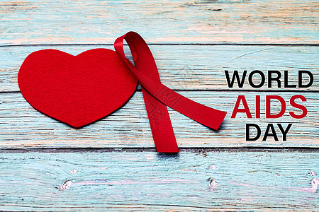 世界艾滋病日 认识信号红丝带 抗艾滋抗艾滋在蓝木本底的标志图片