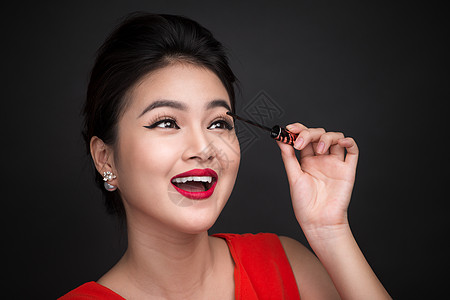 化妆品和化妆品概念 亚洲女性做化妆师的眼睫毛黑面纱女士眼睛刷子女孩皮肤图片