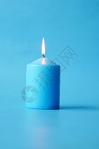 蓝色蜡烛慢慢燃烧烧伤运动火焰优雅快乐背景图片