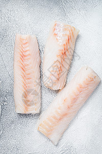 厨房桌上的挪威鳕鱼片 白色背景 顶部视图香料美食海洋海鲜食物炙烤牛扒桌子胡椒杂货店图片