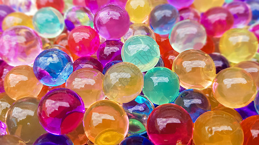许多不同颜色的水凝胶球 组的多彩多姿的 orbis 游戏用水晶水珠 氦气球 可以用作背景 高分子凝胶硅胶圆圈艺术商会庆典国际反射背景图片