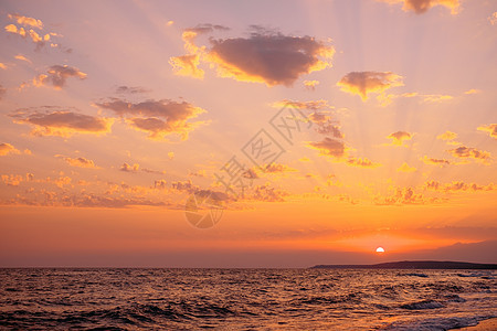 日落在海面上海景地平线太阳海岸黄色晴天天空红色海洋阳光图片