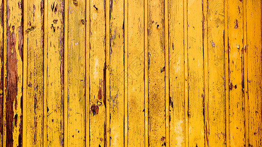 老黄色木材纹理背景 彩绘木墙 黄色背景 由垂直板制成的明亮栅栏 木板的纹理可用于背景 有点开裂的油漆背景图片