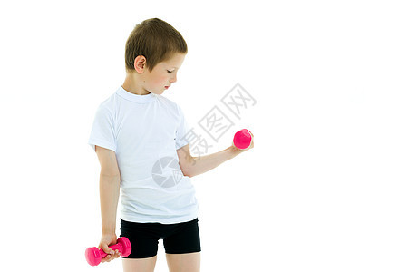 一个小男孩在举哑铃身体手臂孩子健身房肌肉活动活力运动男生动机图片