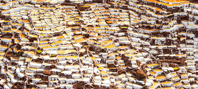 萨利纳斯德马拉斯石头盐场盐碱地矿物平底锅工人生理池塘山脉生产图片