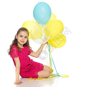 手里拿着气球的小女孩生日幸福婴儿蓝色孩子们快乐孩子派对白色童年背景图片