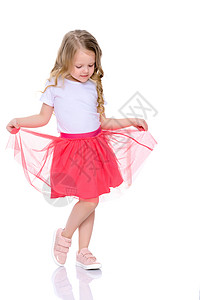 芭蕾舞女演员一个快乐的小女孩在跳舞短裙童年舞蹈家芭蕾舞舞蹈女性班级艺术婴儿姿势背景