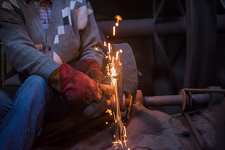金属制品的铁匠打磨工作工艺工厂手工火焰工具作坊锤子男人生产图片