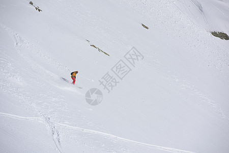 深雪粉雪滑雪者滑雪运动速度男人乐趣闲暇冒险下坡行动衣服图片