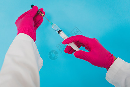 医生手中的Covid 19疫苗小瓶液体测试暴发实验室手套护士药店剂量药物图片