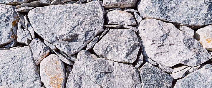 石材质感与外观设计理念 石墙由天然岩石制成作为建筑表面背景装修奢华装饰边界绝缘大理石卵石房地产地板石头图片