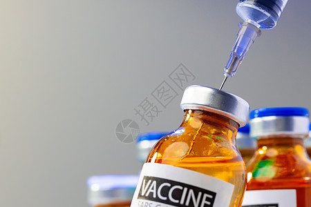配有药物和注射器的医药小瓶瓶子药品医疗疫苗实验室治疗注射治愈背景图片