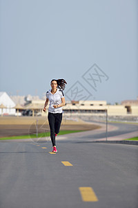 妇女清晨慢跑训练运动员娱乐女孩跑步城市活动赛跑者女性运动装图片
