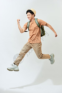 跳跃的年轻人迷人的亚洲年轻人旅行时在空中跳跃着背景
