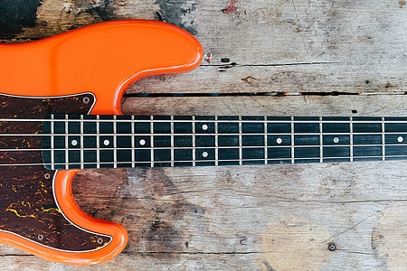 木本底的橙色电贝斯吉他爵士音乐会吉他手歌曲低音娱乐音乐家岩石乐器细绳图片
