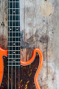 木本底的橙色电贝斯吉他乐器岩石音乐会木头低音旋律娱乐音乐家棕色爵士图片
