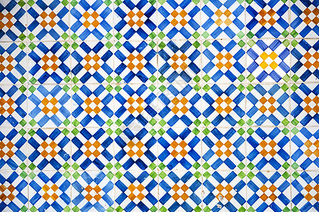 在里斯本一堵墙上贴近多彩的葡萄牙Azulejos铁砖工艺蓝色传统旅行瓷砖陶瓷形状色彩风格文化图片