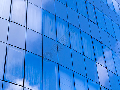 现代建筑中的玻璃墙城市摩天大楼建筑物市中心反射天空商业公司蓝色建筑学图片
