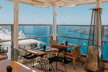 希腊 桑托里尼 火山上方的餐厅 罗马餐馆旅游阳光奢华建筑学食物教会小吃阳台蓝色日落图片