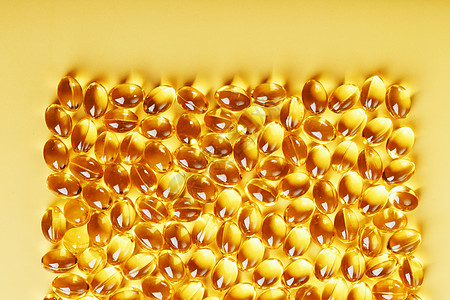 在黄色背景和文字位置上装有液体维生素D3的罐壳中的胶囊药品剂量养分药物补充药店产品金子饮食药片图片