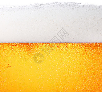紧紧的啤酒背景和玻璃泡泡酒精泡沫饮料橙子啤酒厂宏观背光气泡黄色白色图片
