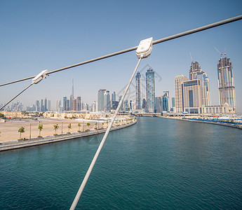 迪拜市迪拜河溪河道桥上的迪拜市全景Dubai Creek旅游天际建筑建筑学地标天线航班天空码头城市图片