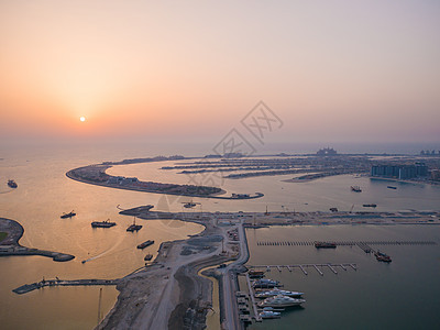 日落和夜晚在迪拜的人工岛屿上 时间倒塌了假期建筑物地标景观建筑全景喷泉建筑学棕榈旅行图片