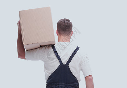一个带大纸板盒的年轻男子情绪化快乐工作服概念送货男人纸盒工作纸板搬运工图片