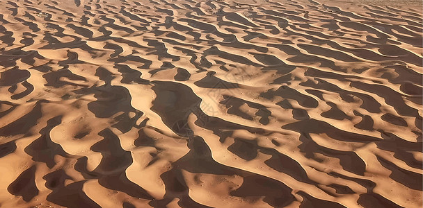 沙漠中的沙丘干旱天空日落土地墙纸爬坡旅游橙子孤独灰尘图片