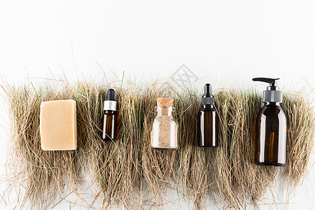 生态化妆品概念 在玻璃瓶中不塑料笔芯奶油瓶子回收洗发水女士玻璃苔藓木头酒吧图片