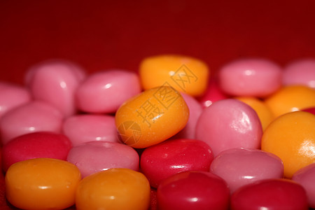 五颜六色的圆形甜甜的泡泡糖特写现代背景大尺寸高质量印刷品孩子们软糖团体紫色食物店铺咀嚼橙子墙纸生日背景图片