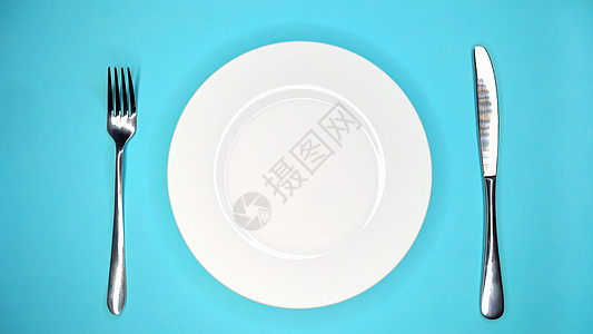 餐桌或咖啡馆 叉子刀 白板放在蓝桌子上的白板图片