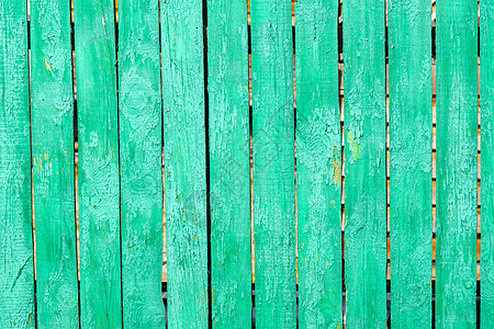 旧木制绿底板 有裂缝和涂料 栅栏 木质纹理图片
