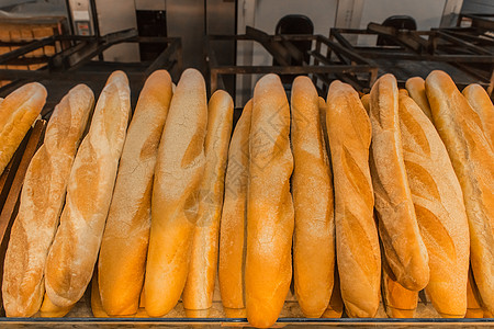 新鲜烘焙食品面包店长方形面包背景咖啡店糕点生活羊角早餐小麦甜点脆皮木头产品图片