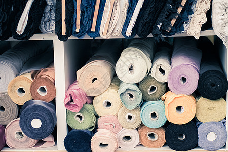 纺织商店制造业制造业的有色织布 鲜彩服装棉花卷白色材料圆形仓库团体裁缝棉布艺术收藏绿色图片